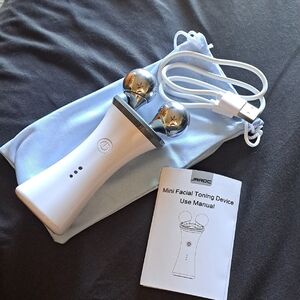 Mini Facial Toning Device in White with Silver Spheres